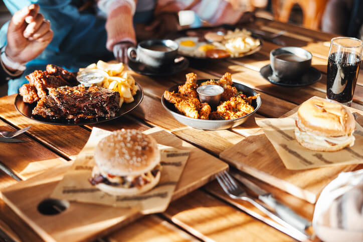 Person taking photo of restaurant meal with phone